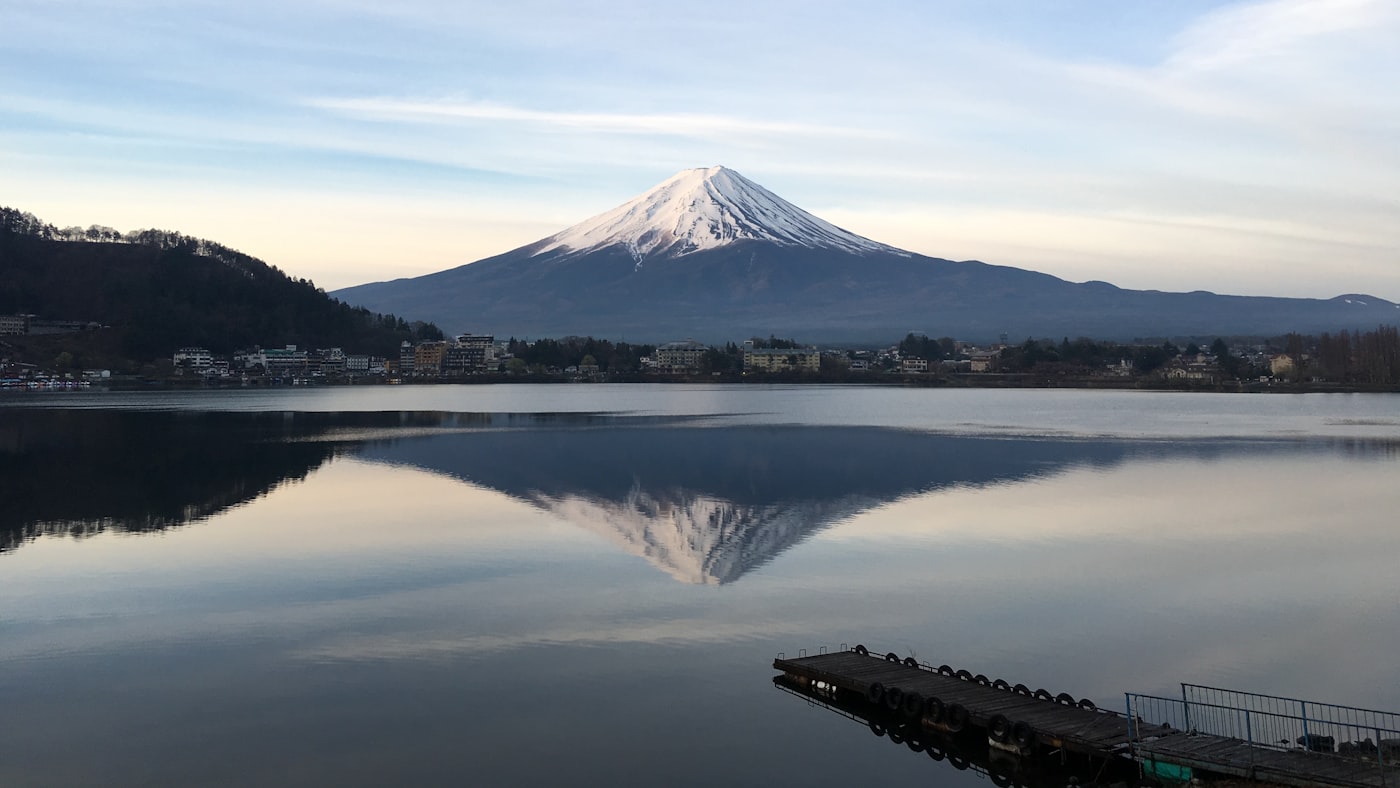 Mount Fuji reflected in the still surface of a lake