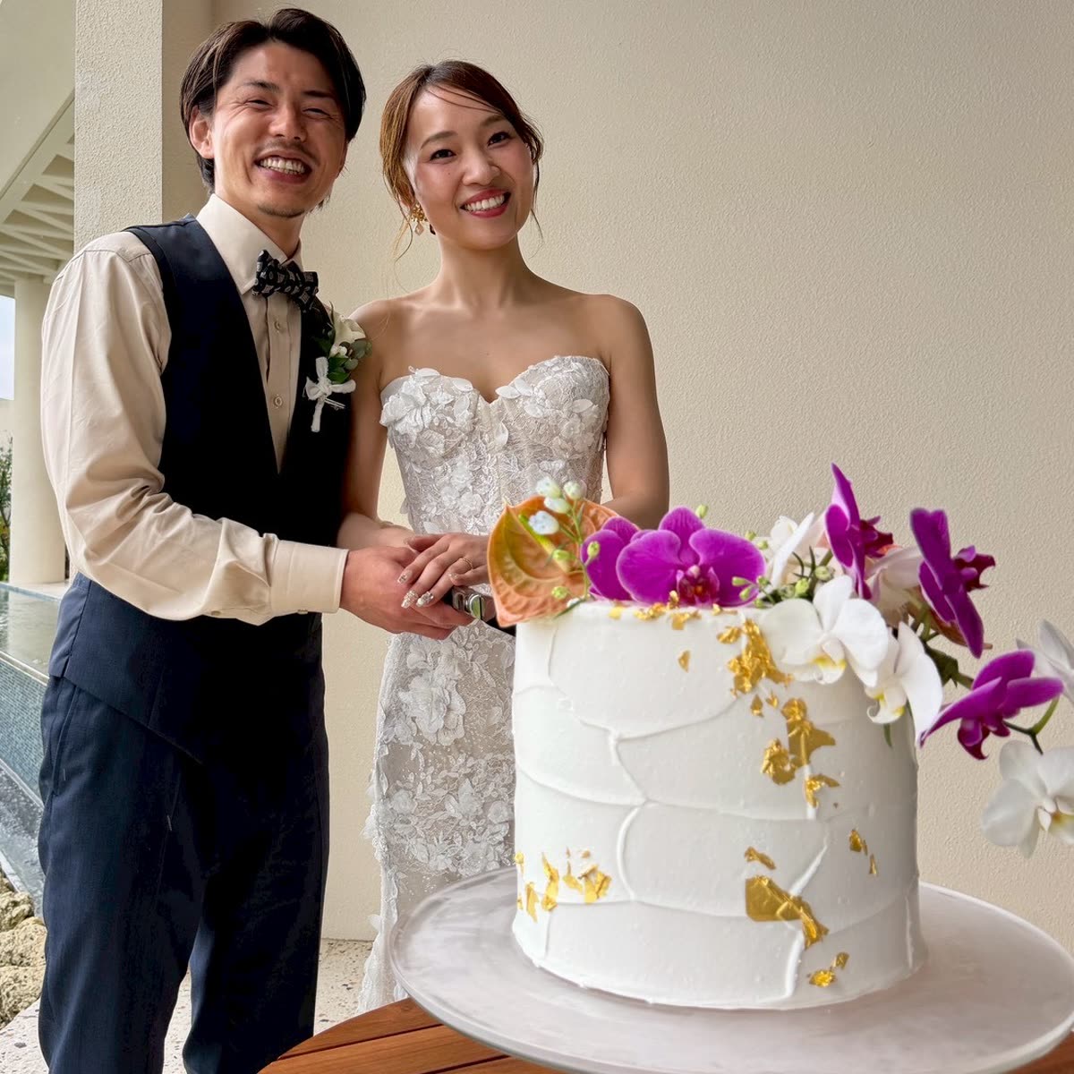 Bride and groom cutting their wedding cake, a CJC wedding-film client