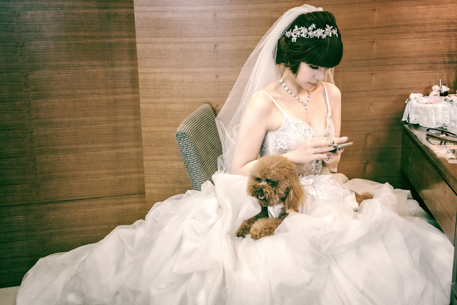 Bride in a full gown seated at her wedding venue before the ceremony