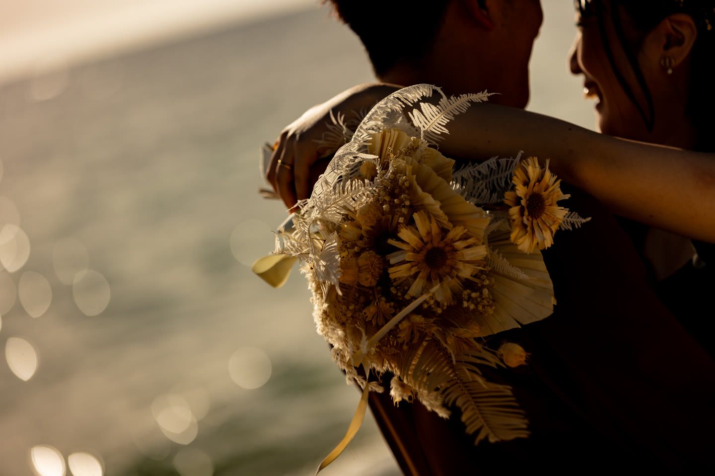 Dried flower bouquet backlit by the afternoon sun