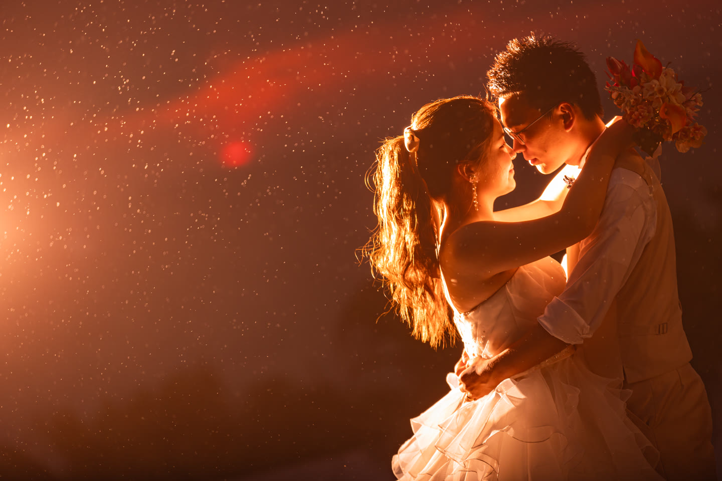 Couple embracing in warm golden light during an Okinawa pre-wedding shoot