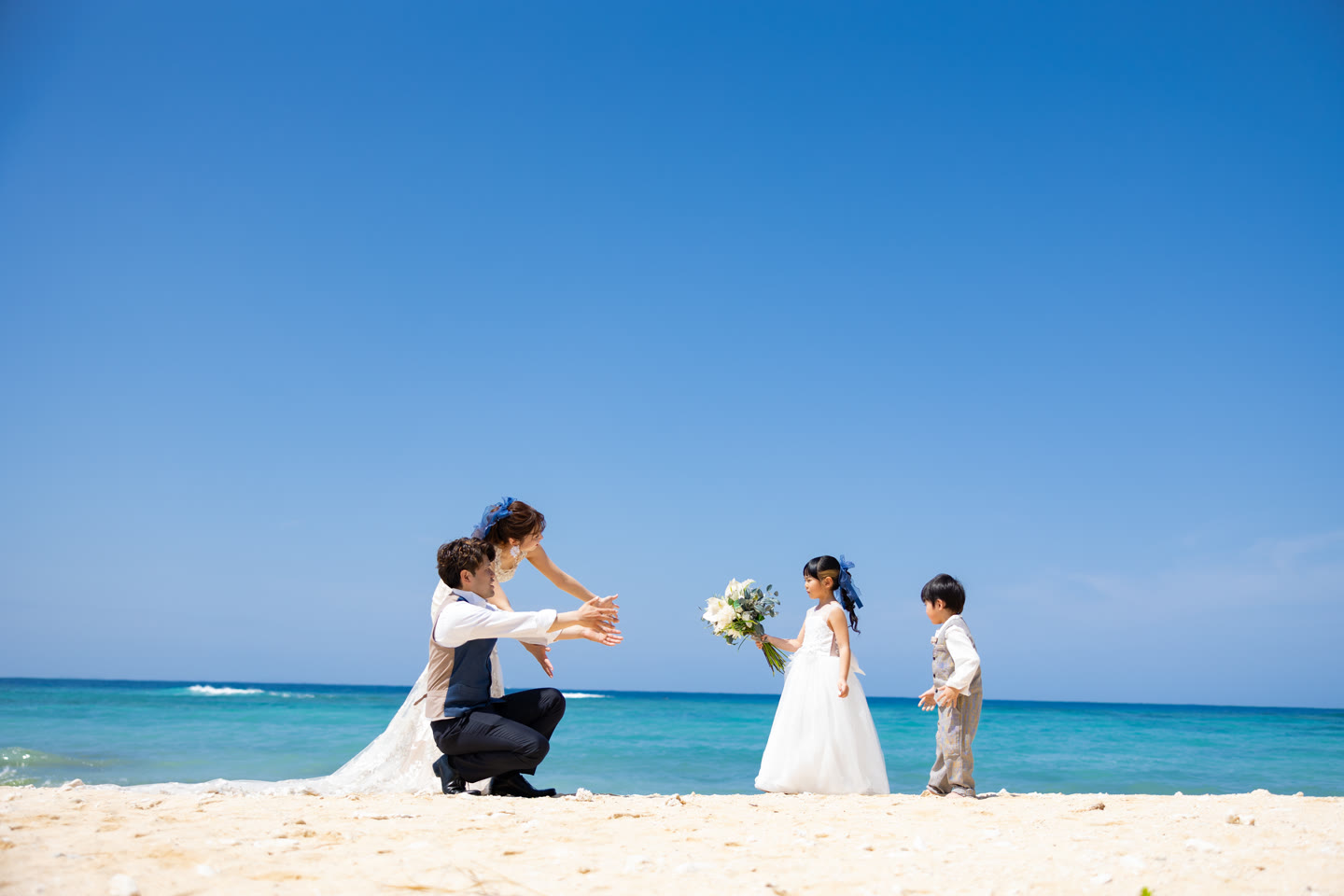 Couple photographed with their children on an Okinawa beach