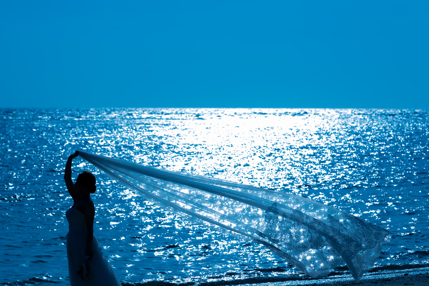 Veil lifting over deep blue Okinawa water