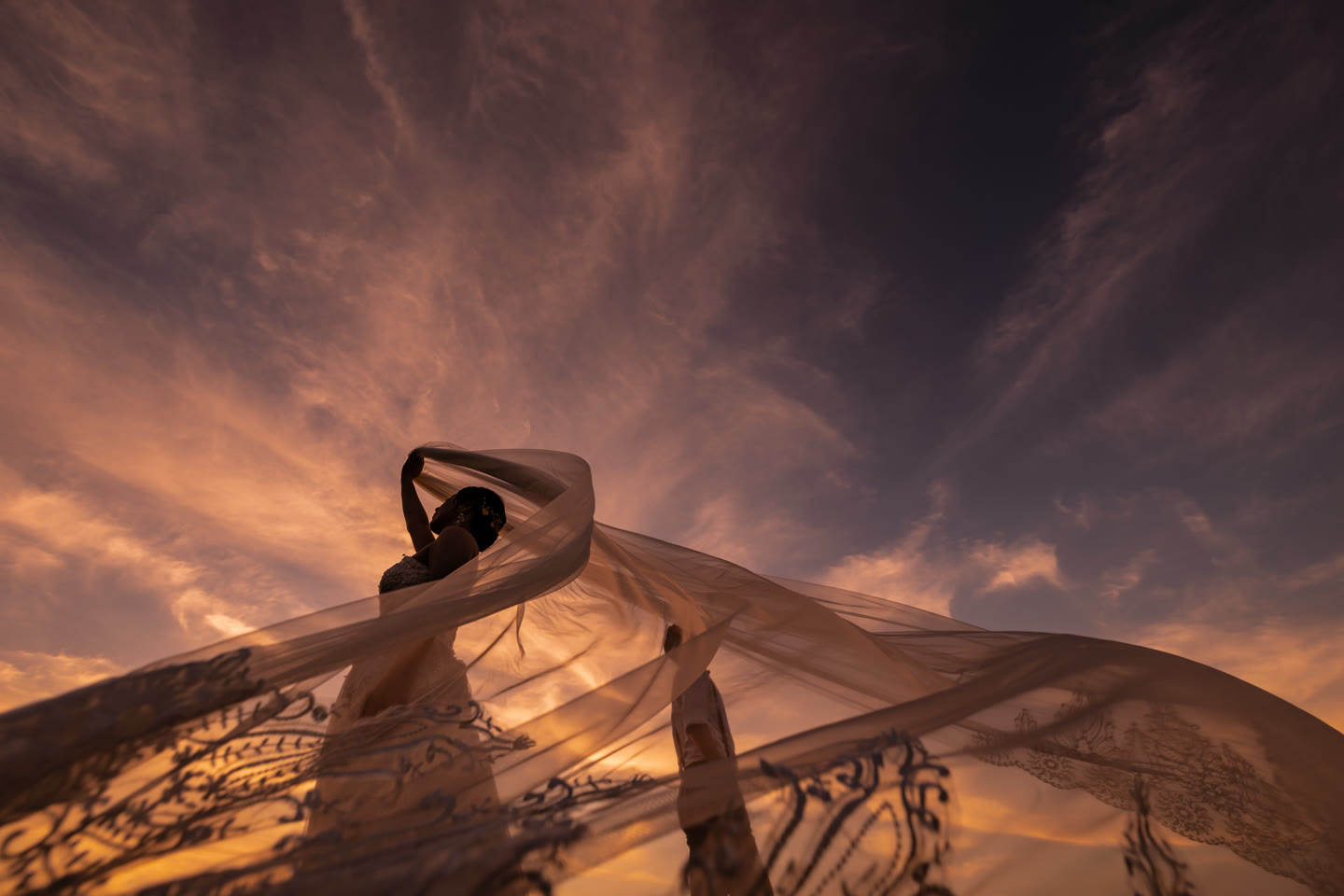 Bridal veil rising into a golden evening sky in Okinawa