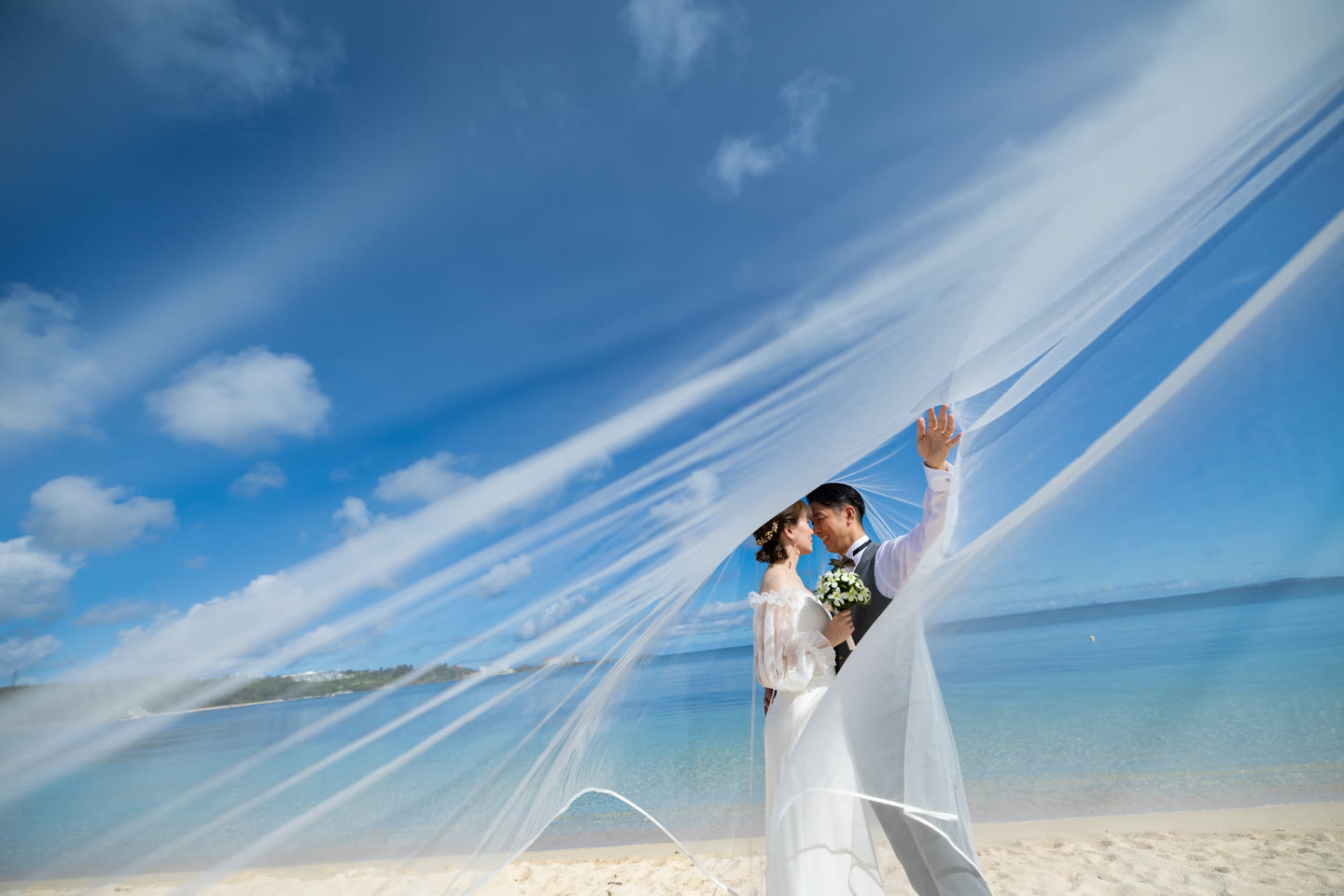 Veil caught by the wind above an Okinawa beach
