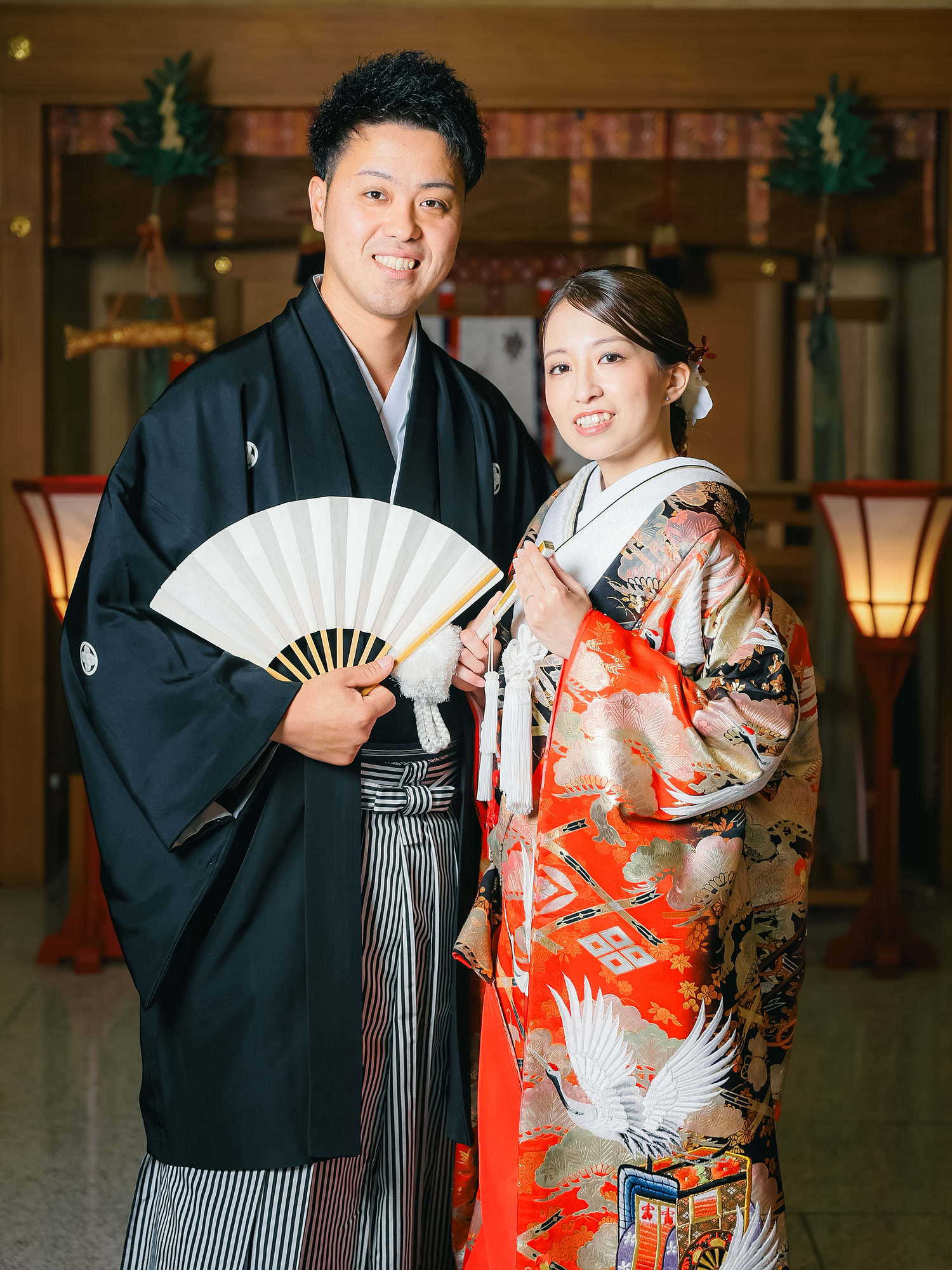 Bride in an embroidered Japanese wedding kimono, photographed inside a shrine hall
