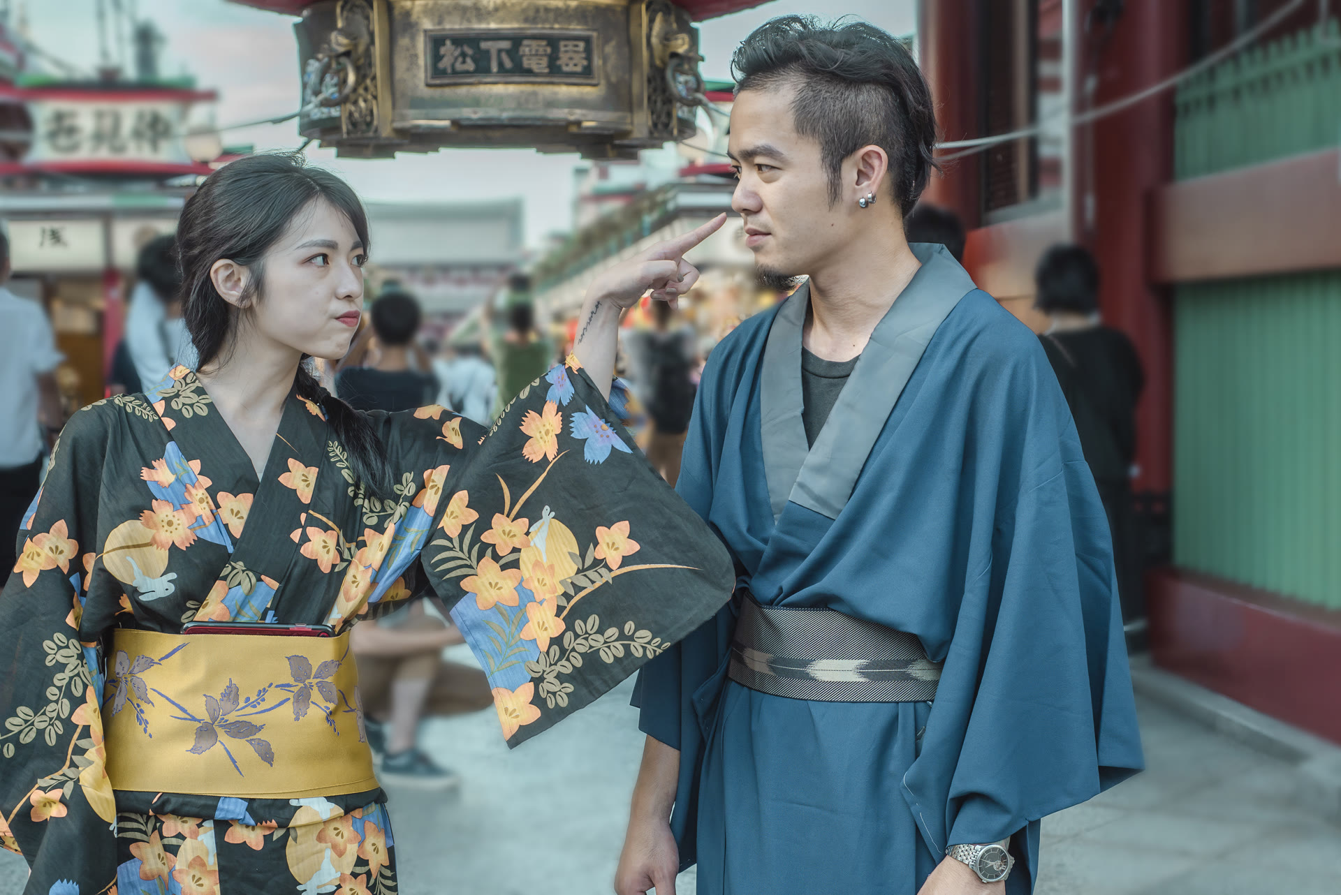 Couple in kimono on an old Asakusa street in the afternoon