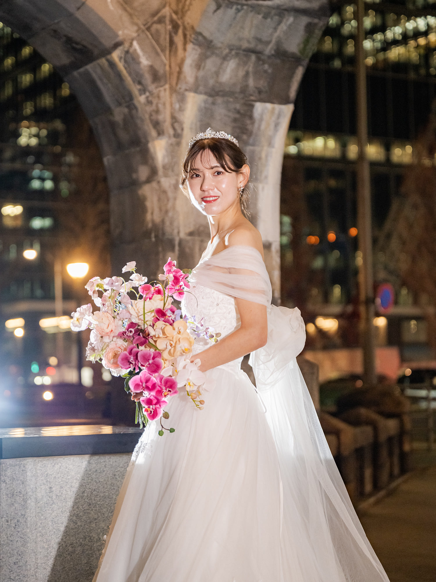 Editorial bridal portrait with flowers against the Tokyo night skyline